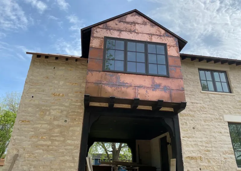 Copper metal panel facade on a stone building for Skylight Installation in Memphis